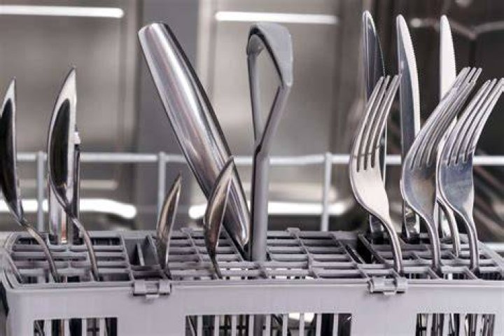 What is the correct way to put cutlery in a dishwasher?